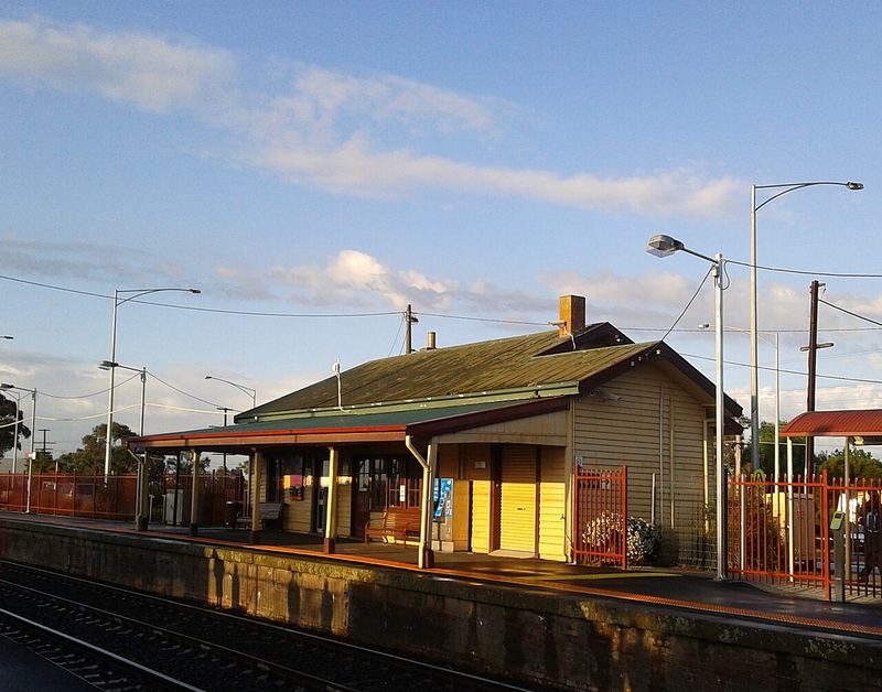 Wallan railway station platform and heritage station building in golden evening light